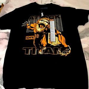 An adult small shirt from Spencer’s that states “attack on Titan”